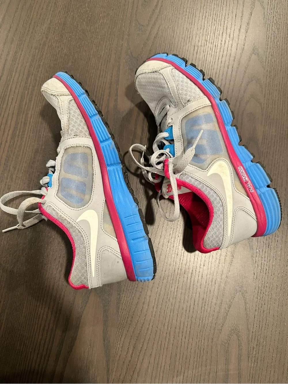 Nike Gray Sneakers with Pink Lining and Blue Accents